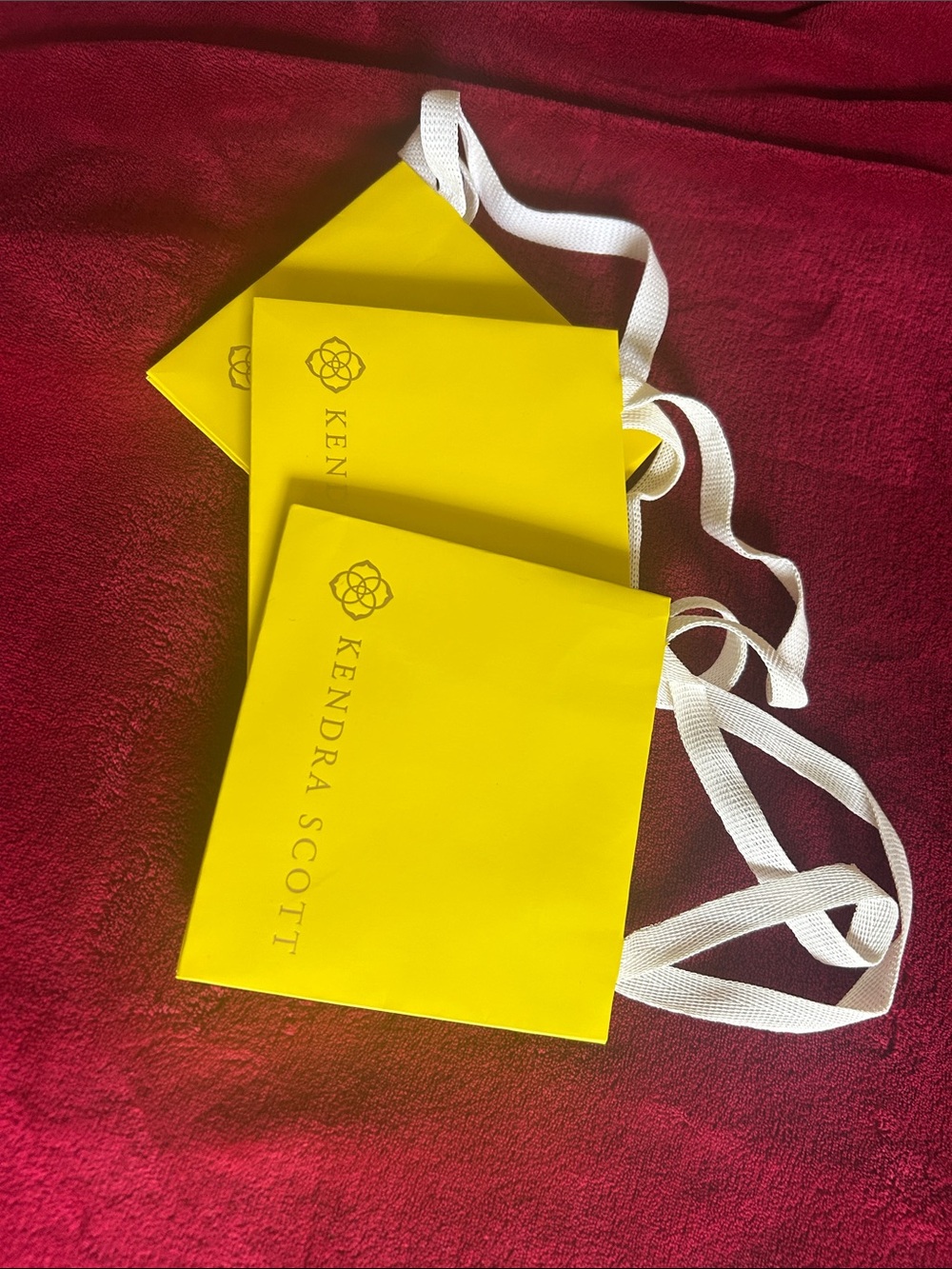 Kendra Scott Yellow Branded Gift Bags with White Ribbon Handles